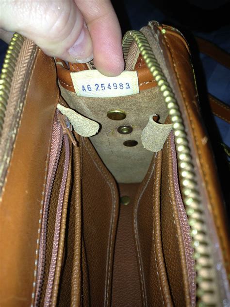 dooney and bourke wristet real or fake leather tag|dooney and bourke counterfeit.